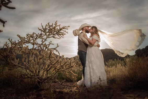A kiss in the desert wind, veil flying