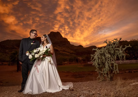 Fiery Tucson sunset behind the newlyweds