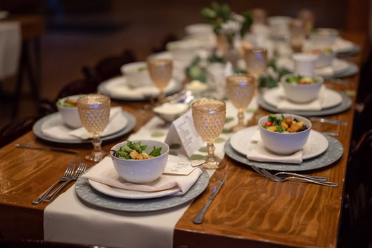 Farm-table place settings at the reception